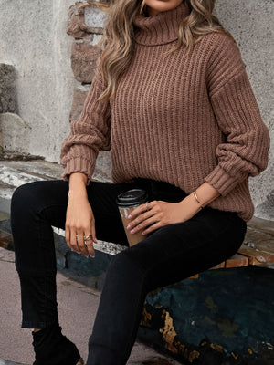 Chunky ribbed turtleneck sweater in caramel with relaxed fit and cuffed sleeves.