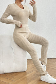 Beige ribbed knit co-ord set with v-neck long sleeve top and fitted pants.