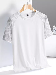 Men's white activewear tee with grey geometric patterned sleeves and crew neck.