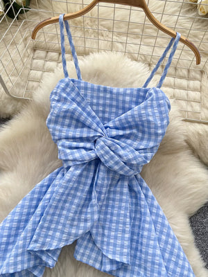 Blue gingham cami top with asymmetrical twisted knot detail and spaghetti straps.