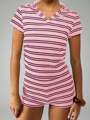 Pink striped knit two-piece set with collared neckline and short sleeves.