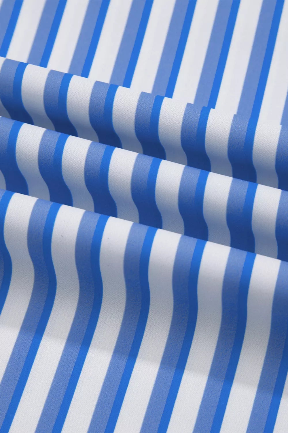 Blue and white striped maternity pants with a wide-leg ankle cut and pockets.