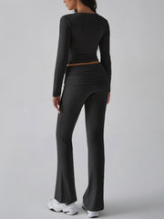 Black long sleeve loungewear set with flared pants and square neck top.