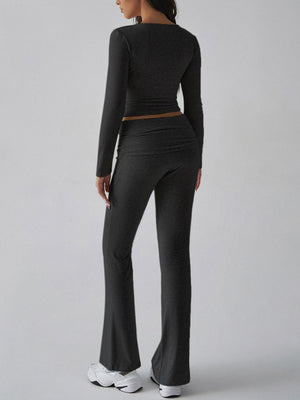 Black long sleeve loungewear set with flared pants and square neck top.