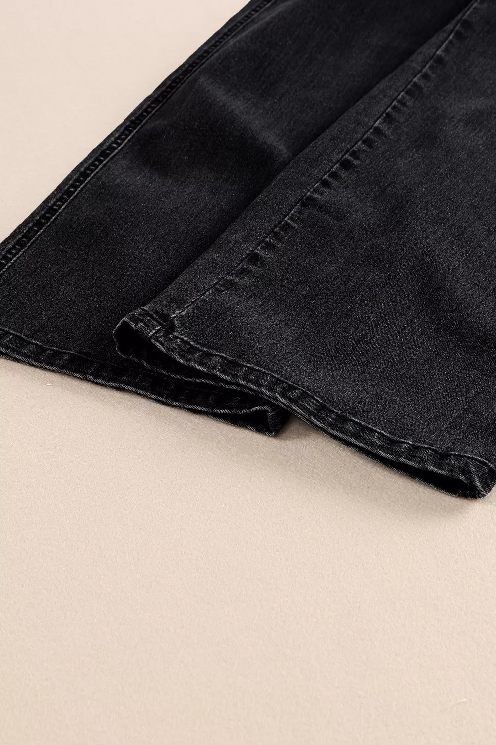 Black denim wide-leg jeans with button fly detail