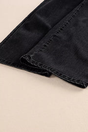 Black denim wide-leg jeans with button fly detail