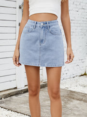 Light wash denim mini skirt with classic five-pocket styling and button fly.
