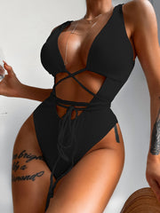 Black ribbed one-piece swimsuit with plunging neckline, cut-outs and wrap tie detail