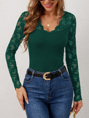 Dark green ribbed top with scalloped lace neckline and sleeves.