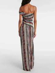Vibrant one-shoulder maxi dress with chevron pattern and asymmetrical neckline.