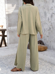 Sage split-front palazzo pants and button-down shirt set with textured fabric.