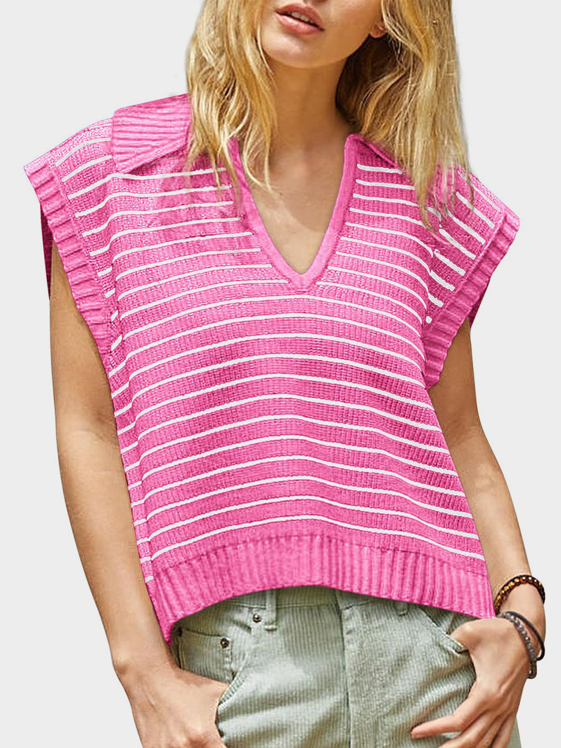 Pink ribbed knit polo vest with white horizontal stripes and a V-neck.