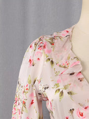 Charming ruffled floral mini dress with pink roses and green leaves on a light pink sheer fabric.