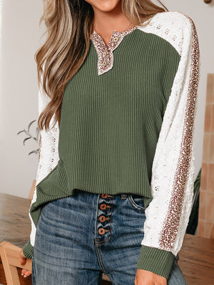 Dark green waffle knit henley with white lace sleeves and leopard print trim