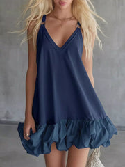 Navy V-neck mini dress with bubble hem and ruffled detail.