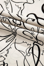 Ivory blouse with abstract black scribble print and balloon sleeves