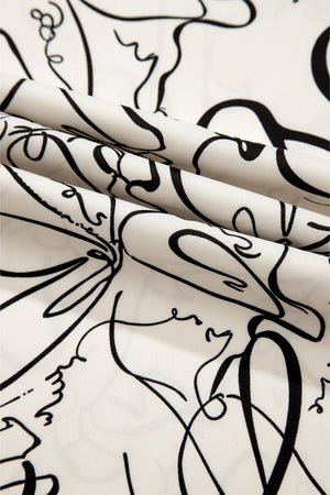 Ivory blouse with abstract black scribble print and balloon sleeves