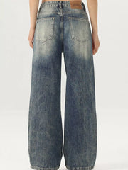 Men's vintage-inspired wide-leg jeans in distressed blue denim with a baggy fit.