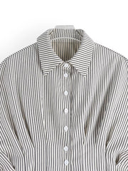 Maternity shirt with black vertical stripes, button-down front, and cinched waist detail.