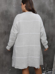 Gray grid-stitch sweater dress with subtle A-line flare and long sleeves.