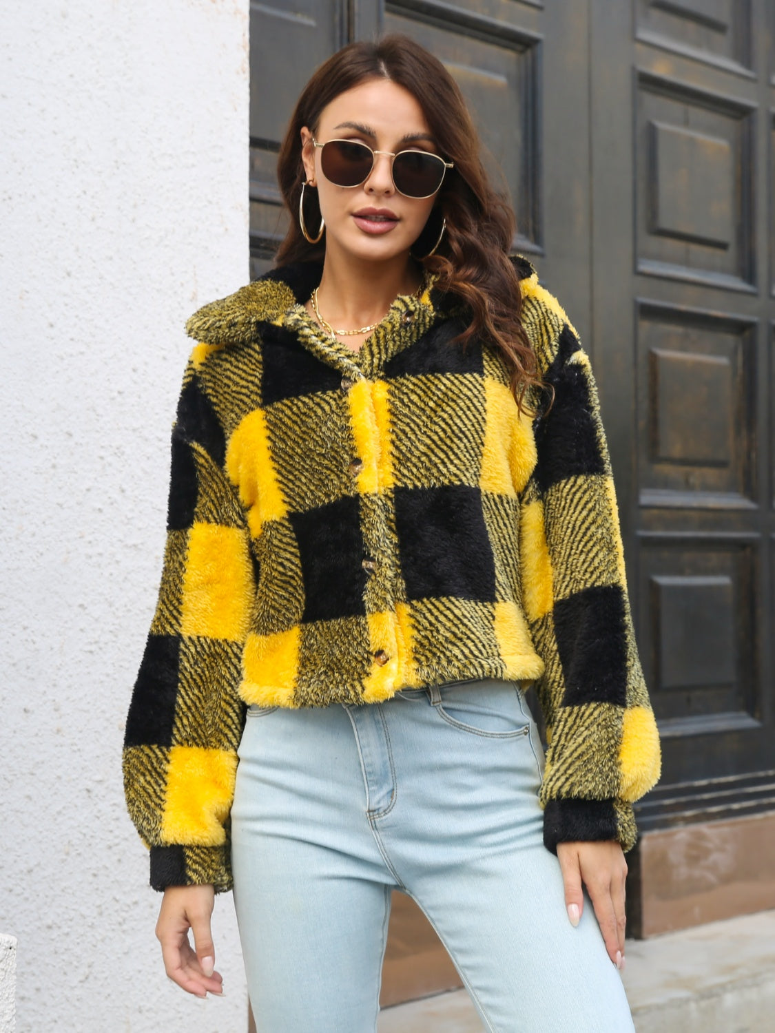 Textured plaid teddy crop jacket in black and gold with button front and collar.