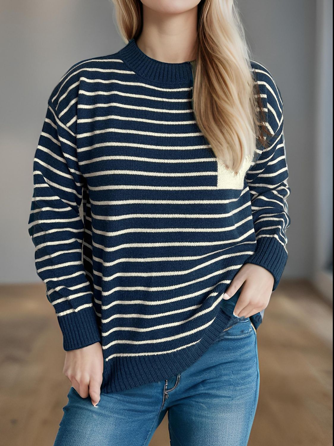Dark Blue striped knit sweater with asymmetrical pocket detail.