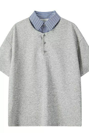 Light gray relaxed fit polo with buttoned placket and blue striped collar.