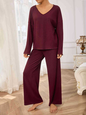 Burgundy ribbed loungewear set with v-neck top and wide-leg pants.