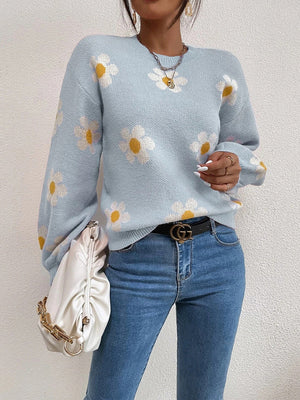 Misty Blue knit sweater with all-over white daisy print and puff sleeves.