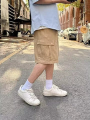 Camel relaxed fit cargo shorts with flap pockets and button closure.