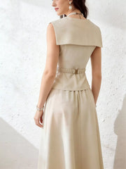 Cream V-neck peplum top and midi skirt set with a belted waist and wide collar detail.