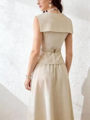 Cream V-neck peplum top and midi skirt set with a belted waist and wide collar detail.