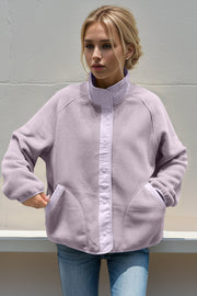 Pink Purple fleece bomber jacket with contrast trim and snap front closure.
