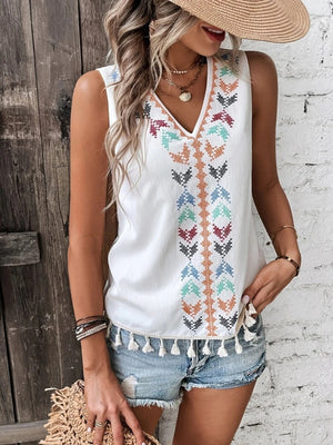 White embroidered V-neck tank top with tassels and colorful geometric pattern.