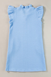 Light blue textured trapeze dress with ruffle sleeves and a ruffled neckline.