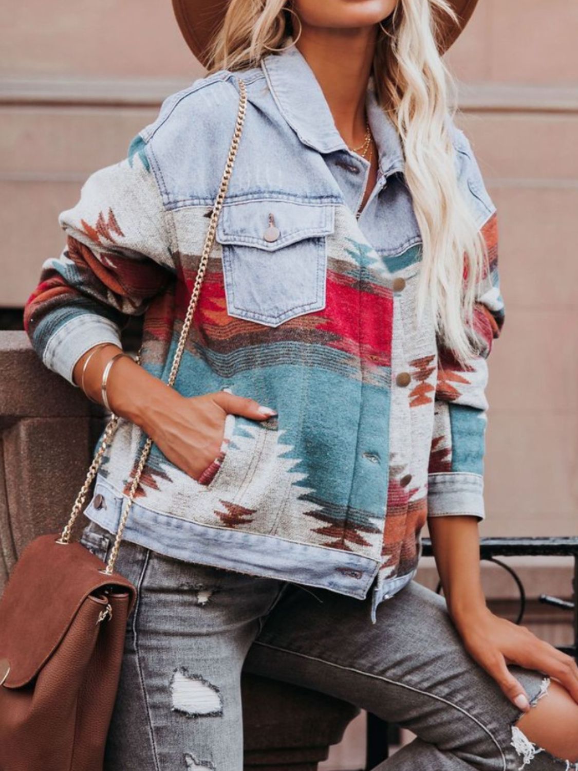 Light blue denim jacket with Aztec pattern, button front, and chest pockets.