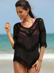Black chevron crochet V-neck cover-up with cutout details and fringe trim.