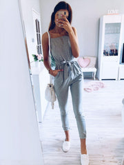 Sleeveless gray jersey jumpsuit with tie waist and cuffed ankles