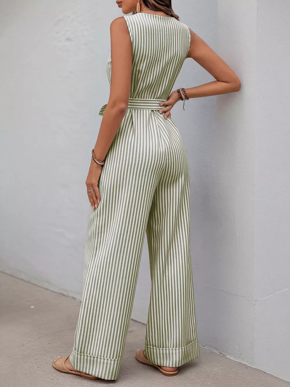 Striped tie-waist wide leg romper in yellow-green cotton with decorative buttons.