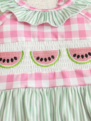 Baby one-piece swimsuit with pink gingham, smocking, and watermelon embroidery.