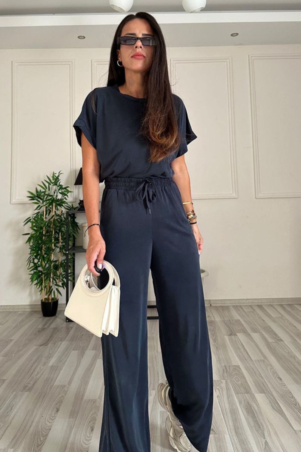Dark blue relaxed fit tee and wide leg pants set with drawstring waist.