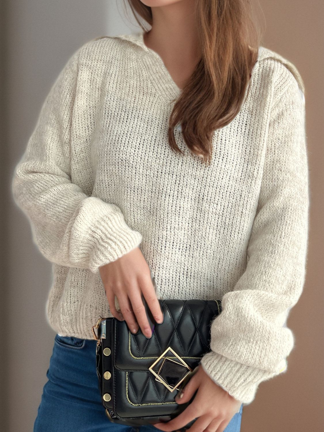 Beige textured polo knit sweater with relaxed fit and balloon sleeves.