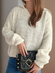 Beige textured polo knit sweater with relaxed fit and balloon sleeves.