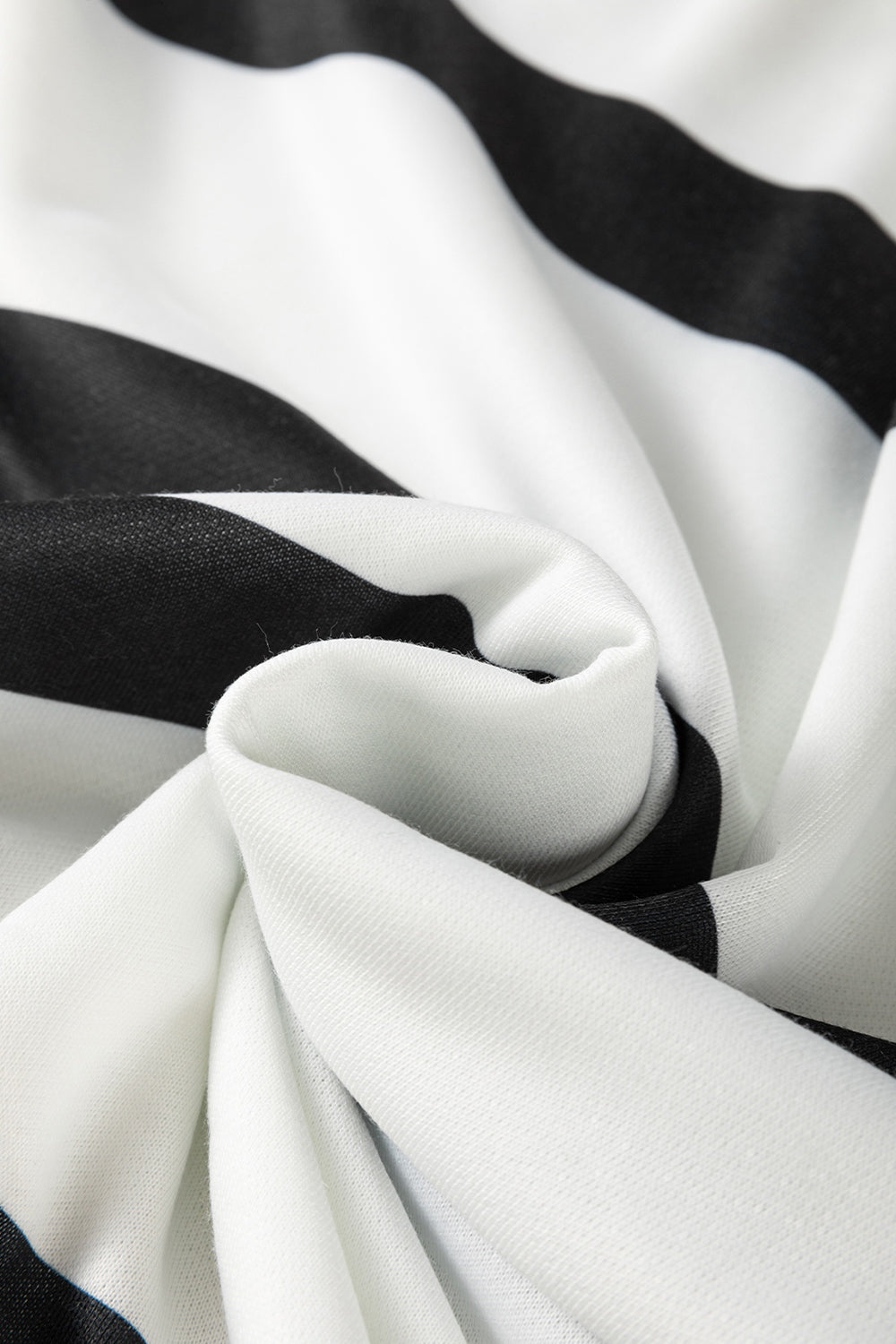 Black and white striped loungewear fabric detail