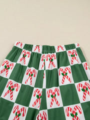 Green pajama pants with a candy cane checkered print and elastic waistband.