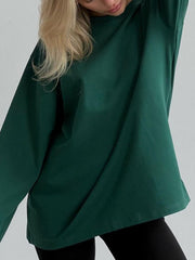Oversized dark green cotton jersey top with long sleeves and a relaxed fit.