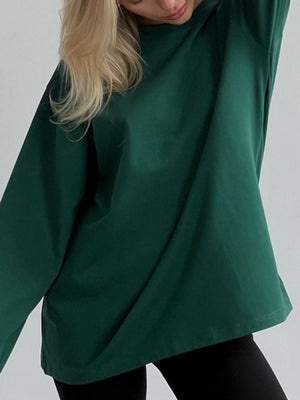 Oversized dark green cotton jersey top with long sleeves and a relaxed fit.