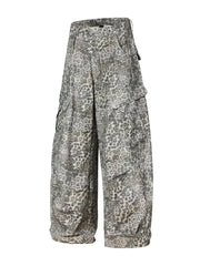 Leopard print cargo pants with utility pockets and a button fly.