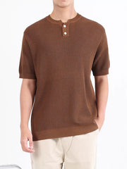 Brown textured knit henley shirt with short sleeves and two white buttons.