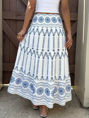 Bohemian maxi skirt with blue floral embroidery and tiered hem